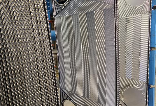 a group of metal pieces with holes