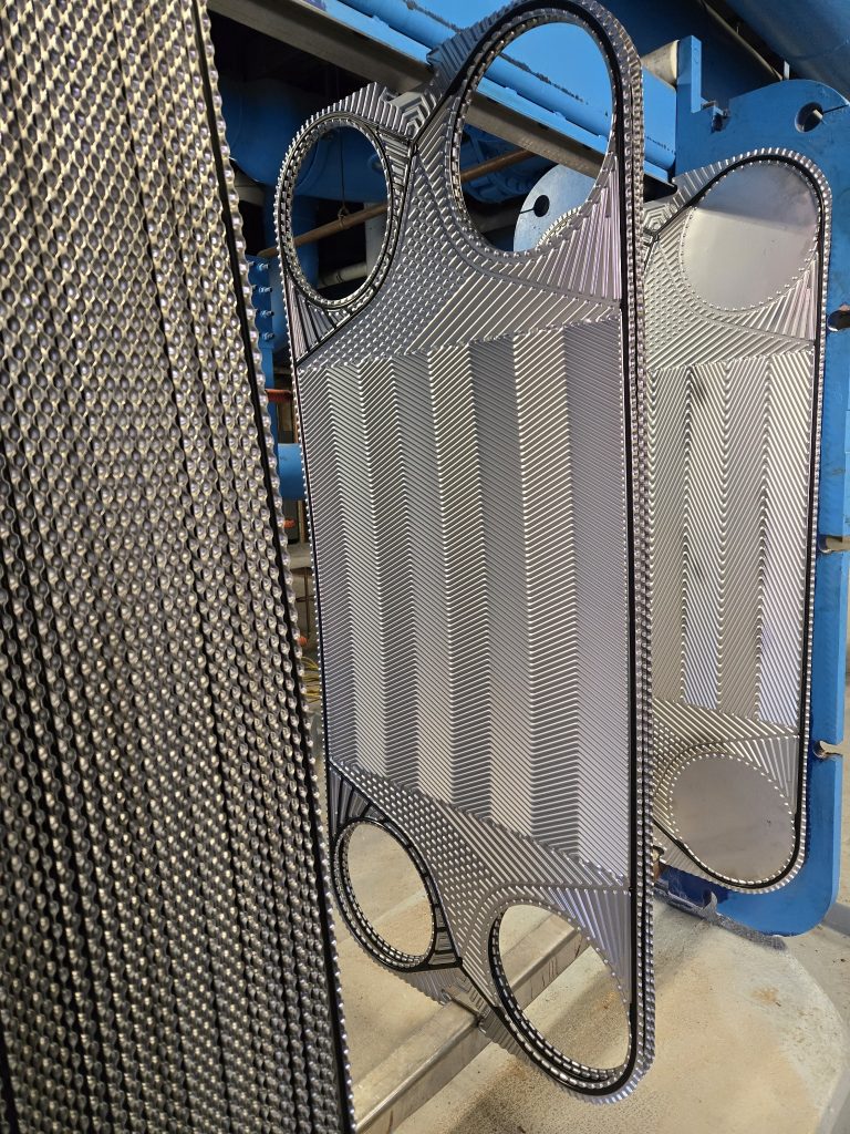 a group of metal pieces with holes